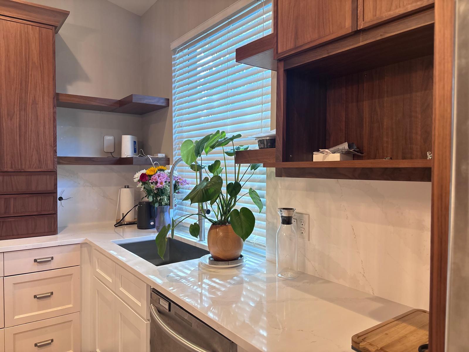 Designer kitchen with green cabinets